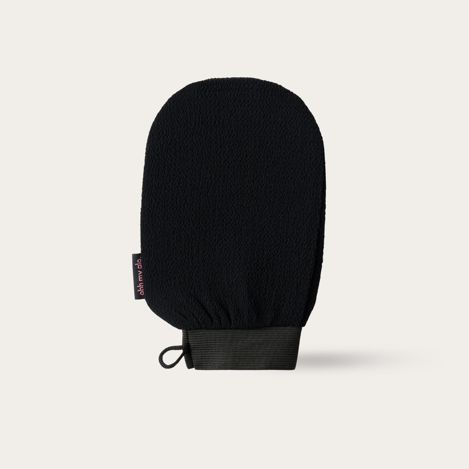 Ohh My Glo Exfoliating Glove product image on beige background